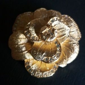 Gold flower brooch with diamond detail